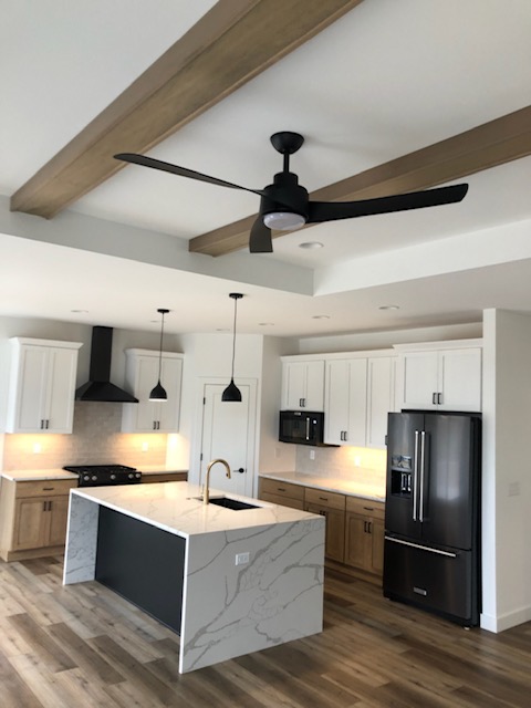 Kitchen island with waterfall edge quartz countertop