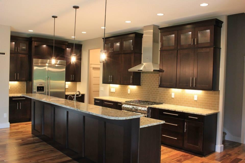 Dark cabinet kitchen with granite countertop